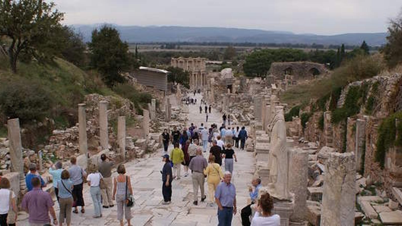 Visitors walking down Curetes Street toward the Library of Celsus in Ephesus