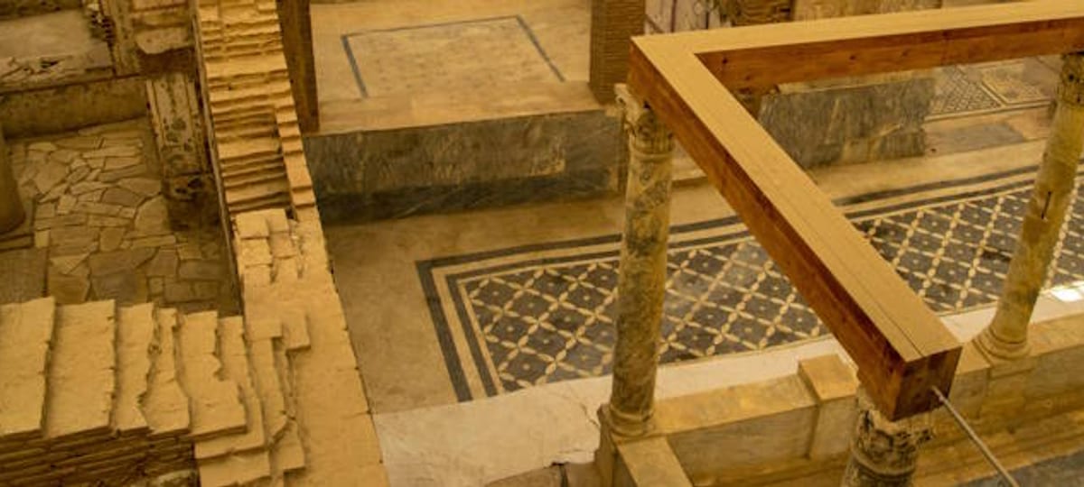 Mosaic floors and marble-panelled rooms of the Terrace Houses at Ephesus seen from the covered walkway above