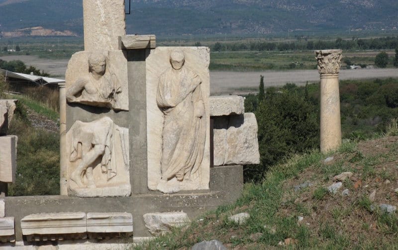 Carved marble relief panels of the Memmius Monument at Ephesus showing a draped toga figure above a horse relief